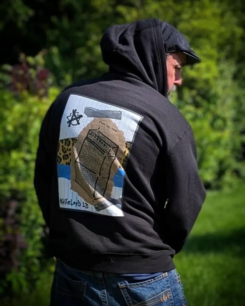 Me in my "Find the Tone!" maze collage hoodie from RedBubble.