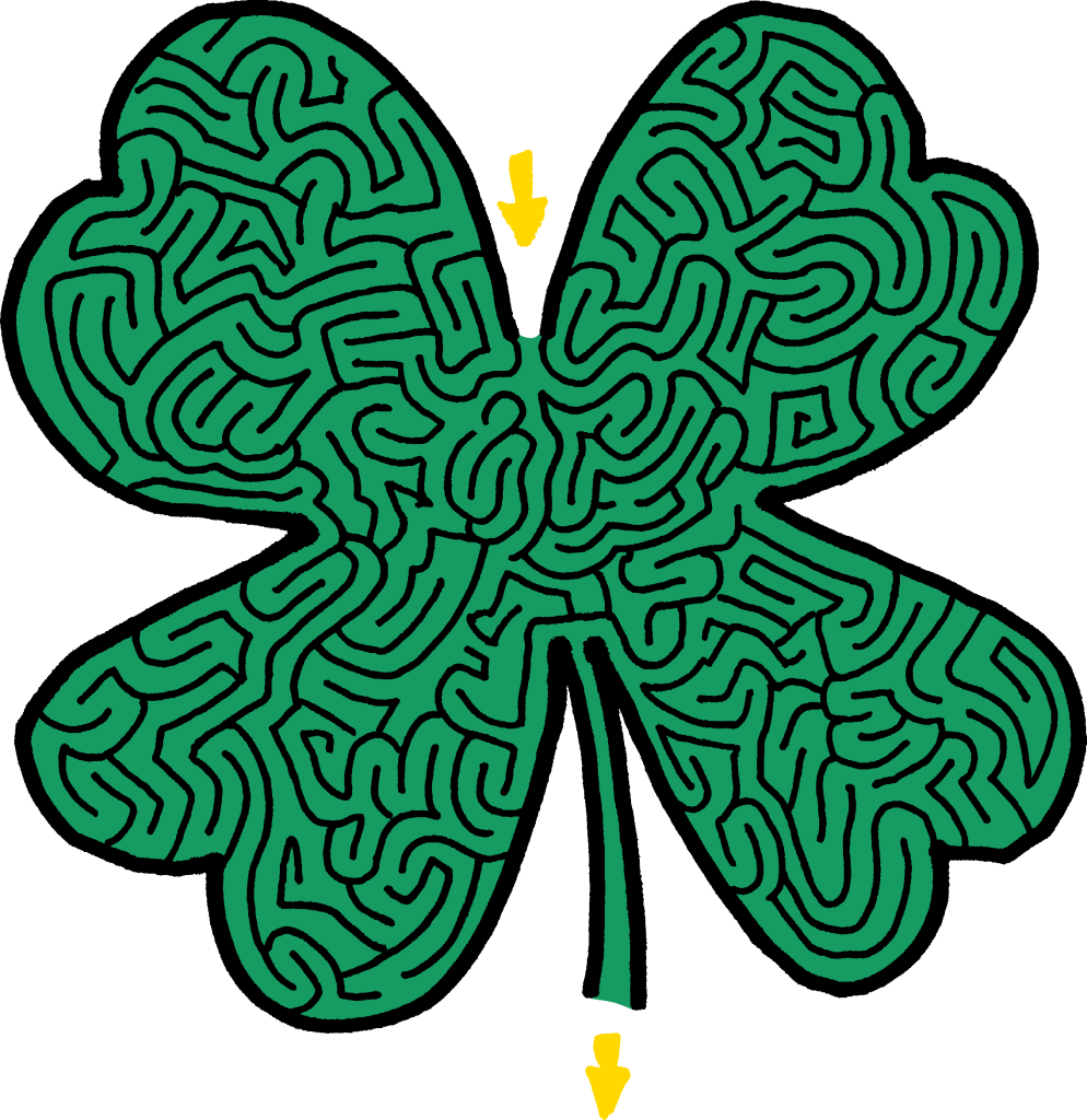 A green four-leaf clover designed as a maze, with intricate pathways and two yellow arrows pointing downward.