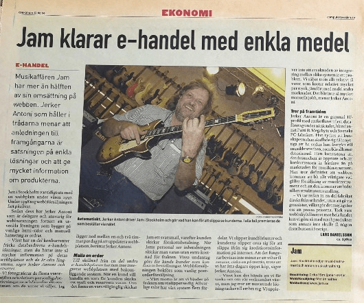 A newspaper clipping in Swedish with the headline "Jam klarar e-handel med enkla medel," featuring a photo of Jerker Antoni holding an electric guitar inside the Jam music store, surrounded by guitars on the wall.
Here is a translation of the main article text and key elements from the Swedish newspaper clipping:
Main Headline
Jam handles e-commerce with simple means
Section Header: E-COMMERCE
Music store Jam generates more than half of its sales on the web. Jerker Antoni, who pulls the strings, believes the secret to their success is investing in simple solutions and providing plenty of information about the products.
Body Text
Jam in Stockholm was early out with a website in the spring of 1997. In 1998, web sales really took off.
Since then, Jerker Antoni—who is a co-owner and responsible for web operations—has continued to develop solutions based on normal HTML pages and manual order handling.
– Some of our competitors have fancy database-driven e-commerce solutions, but you won't find as much information on their websites as on ours, says Jerker Antoni.
– We photograph most of the items we sell, rather than using manufacturer pictures, so the customer knows what we are selling. I spend between one and two hours a day updating the website, says Jerker Antoni.
Mail and Order
Unlike some other e-commerce sites that integrate their website with a back-end system, shopping with Jam involves sending an email and reserving the item. If the item is available, Jam sends a reply email, and the customer sends advance payment. When Jam's staff receives payment, they ship the goods at no extra shipping cost. For regular customers, goods are sometimes sent as regular mail-order sales.
– Our motto is that we are scared of anything that makes us lose personal contact. Honestly, our system solves parts of the integration between different systems as a problem. We sell everything relative to value that costs relatively a lot of manual work, says Jerker Antoni.
Belief in the Future
Jerker Antoni is an old IT profile with a past in several pioneering computer initiatives, including Partille Megabyte and Svenska PC-fabriken. He thinks that the computer industry has been slow to transition to e-commerce, which is becoming more computerized. He notes that the computer industry is open and competition is tougher there than in the music industry. He definitely believes that the web will become even more important when it comes to selling musical instruments and that this will drive structural change.
– We already source parts of our manufacturing directly from abroad, without going through wholesalers, which makes it possible for us to lower prices. Thanks to our web-based network, we can reach our products to the entire country, which would otherwise require two distributions in Sweden, says Lars Danielsson.
Box: Jam
Jam: Music store in Stockholm selling musical instruments and other music equipment.
Turnover: Roughly 15 million Swedish kronor.
Web sales: Roughly 8 million Swedish kronor.
Website: www.jam.se